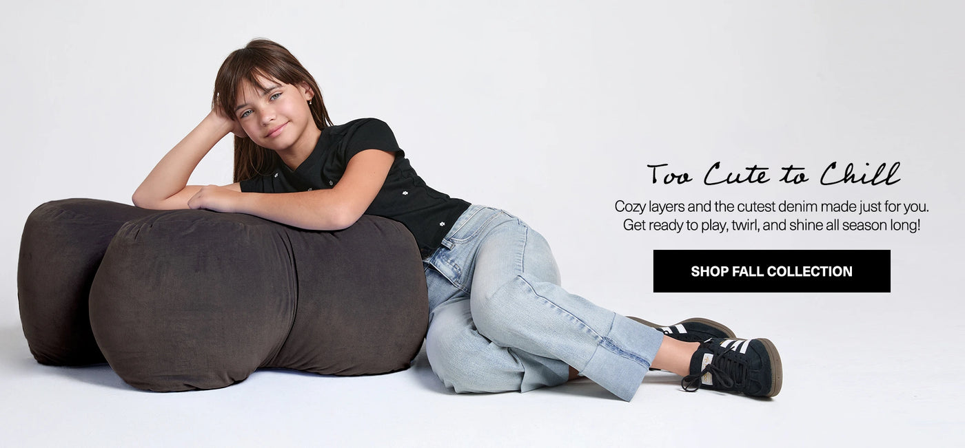 Person sitting on a large bean bag with promotional text for a fall collection.