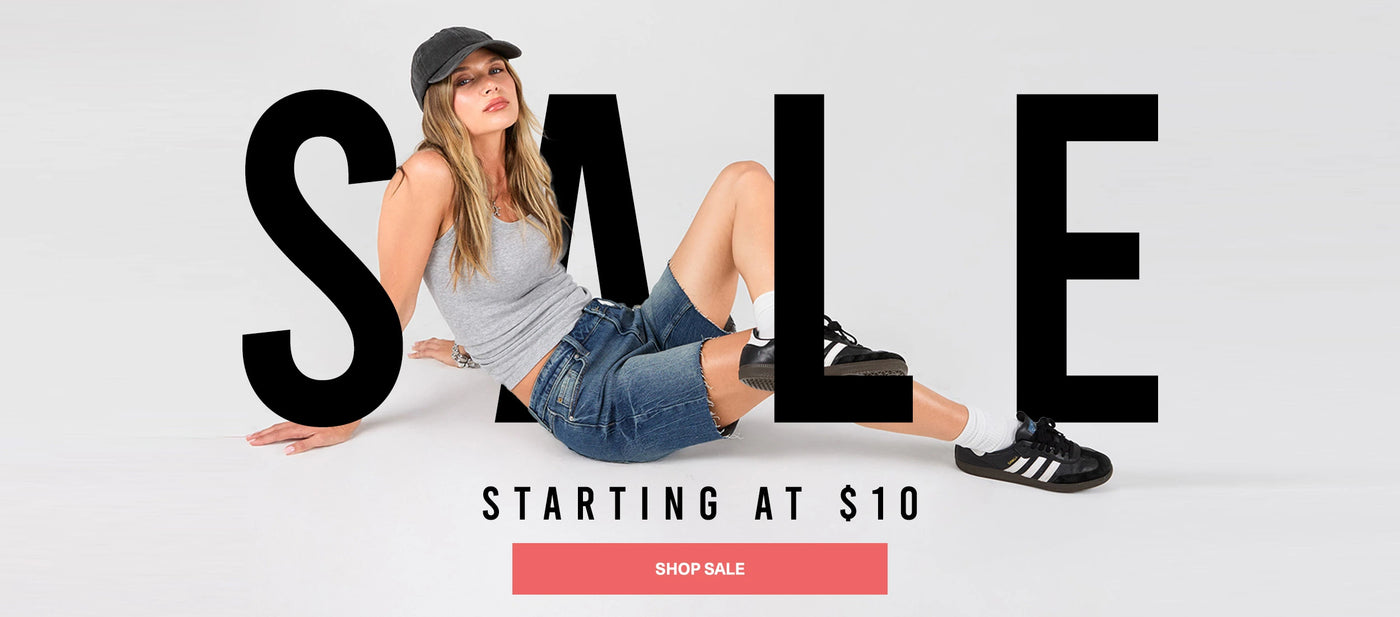 Woman sitting on the ground with 'SALE' text and promotional offer on a light gray background